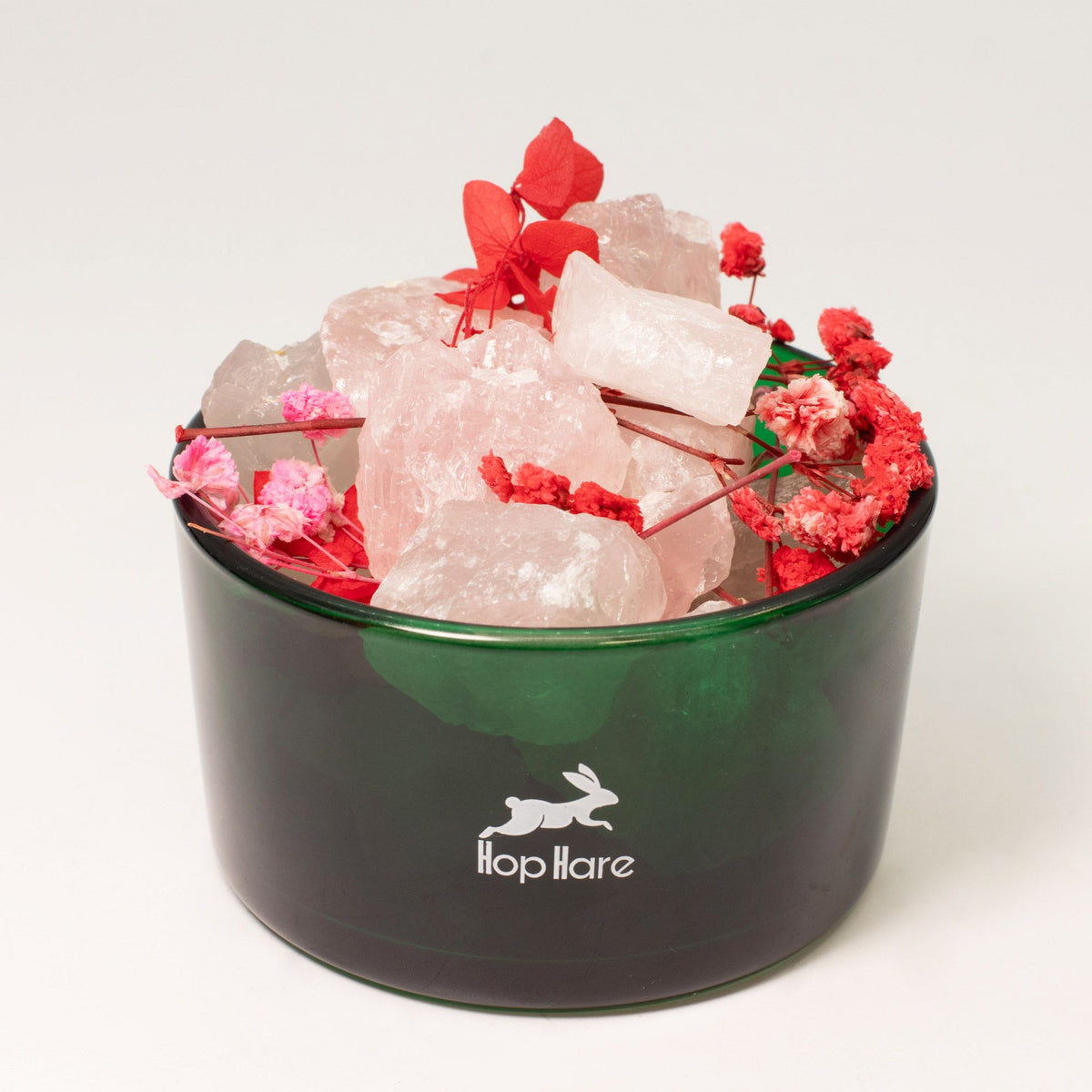 Decorative container with crystals and flowers labeled 'flap hare' on a white background