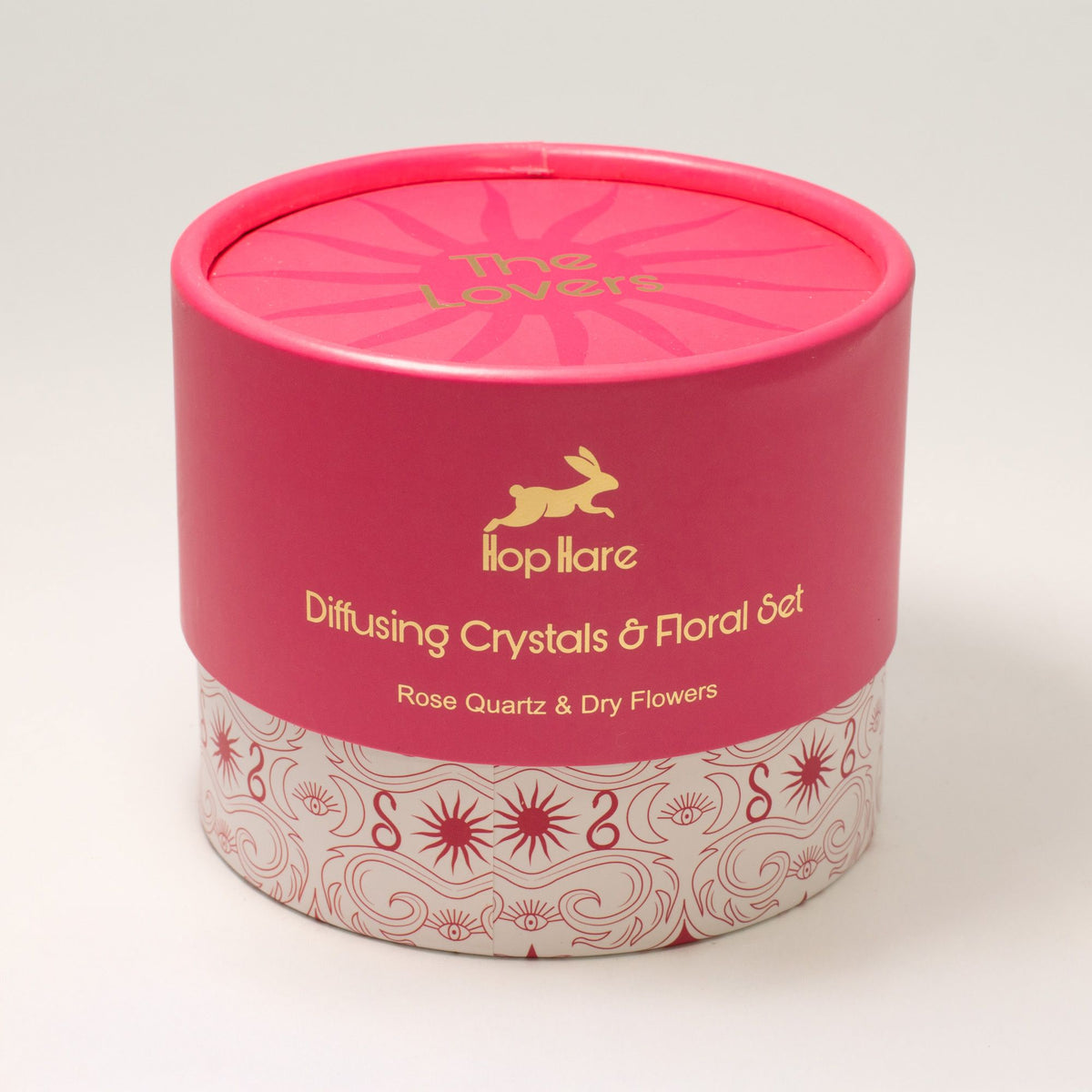 Pink cylindrical container with 'The Lovers' branding on a white background