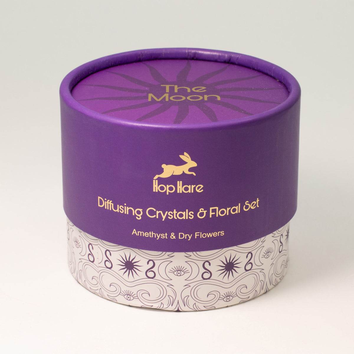 Purple cylindrical container with 'The Moon' branding on a white background