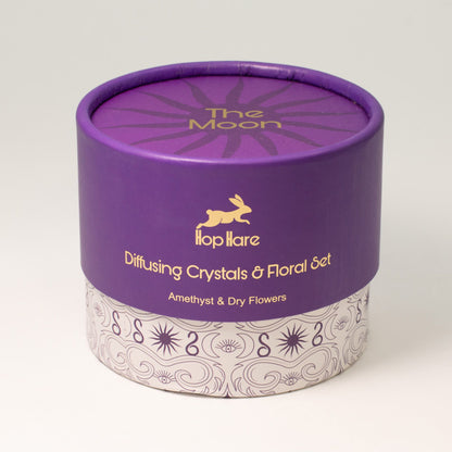 Purple cylindrical container with 'The Moon' branding on a white background