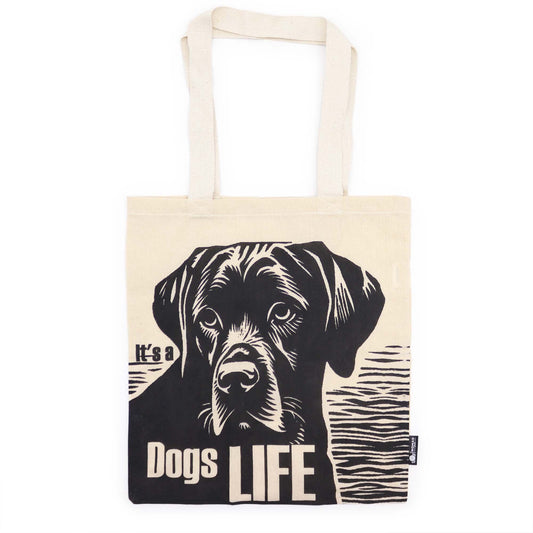 Tote bag with a black and white dog illustration and 'It's a Dogs Life' text on a white background