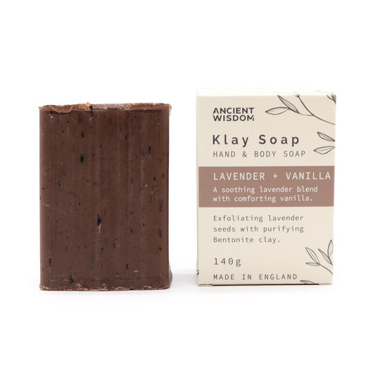 Bar of Klay Soap next to its packaging on a white background