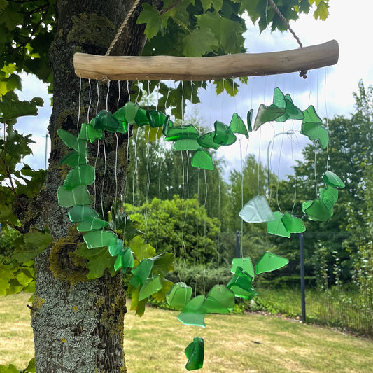 Bring harmony and a touch of nature to your outdoor space with a Recycled Glass Wind Chime Love Chime Green. 