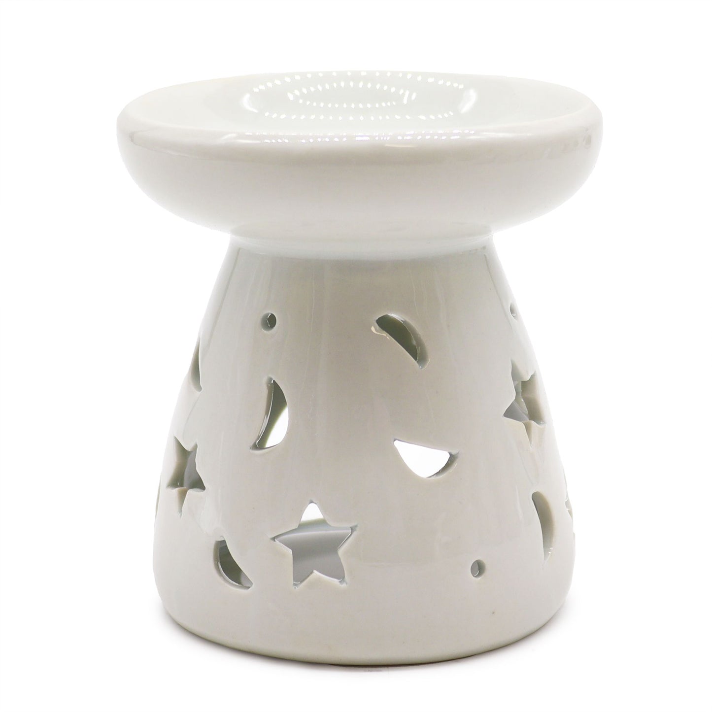 White ceramic oil burner with star and moon cutouts on a white background