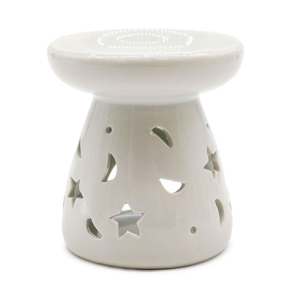 White ceramic oil burner with star and moon cutouts on a white background