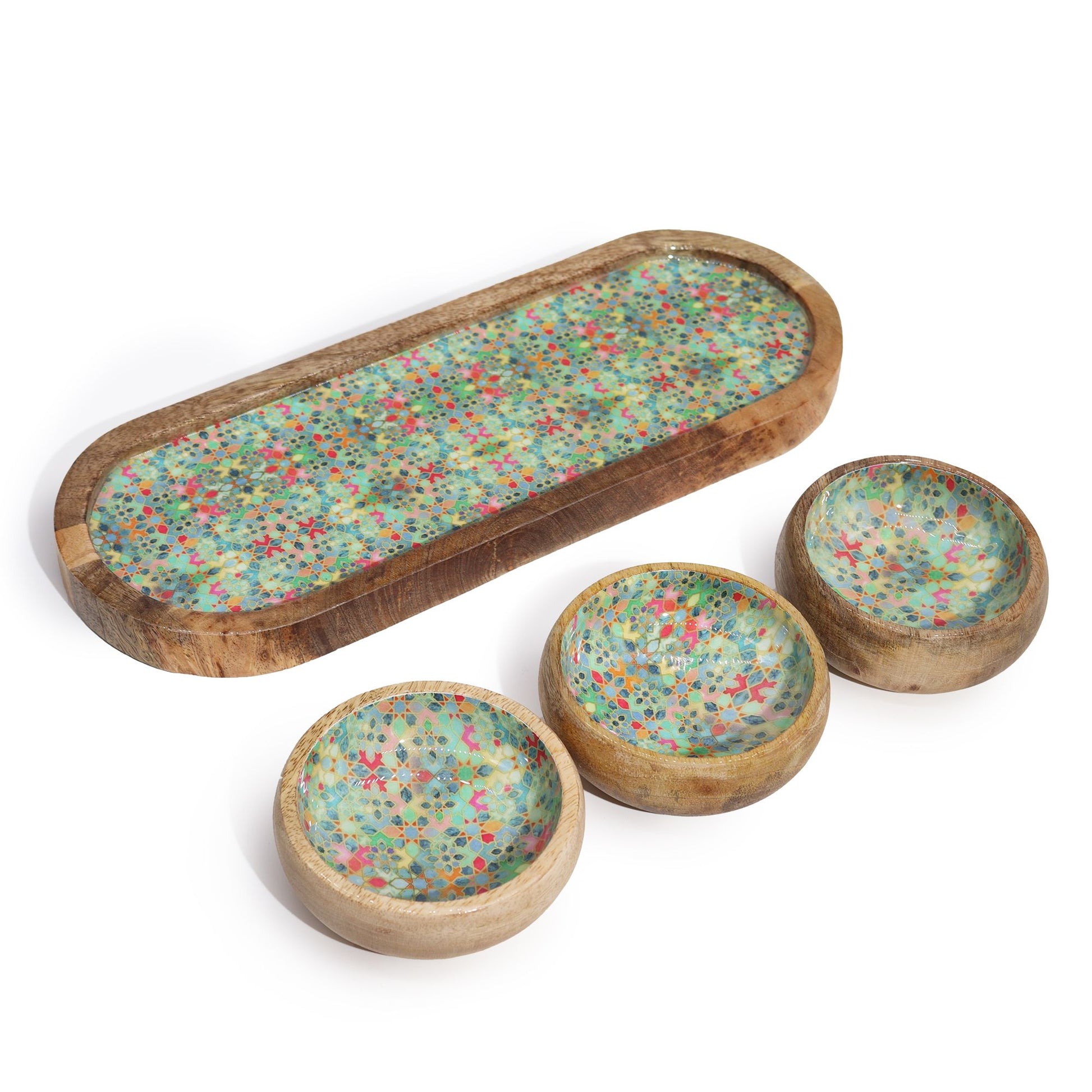 Set of wooden trays with multicolored speckled design on a white background