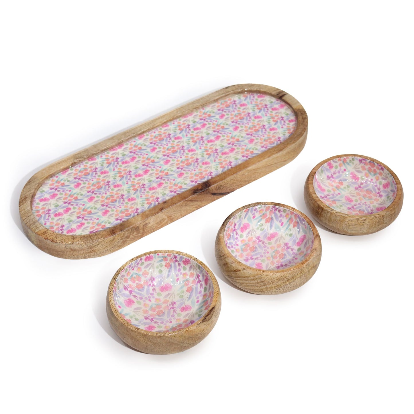 Set of wooden bowls with floral pattern on a white background