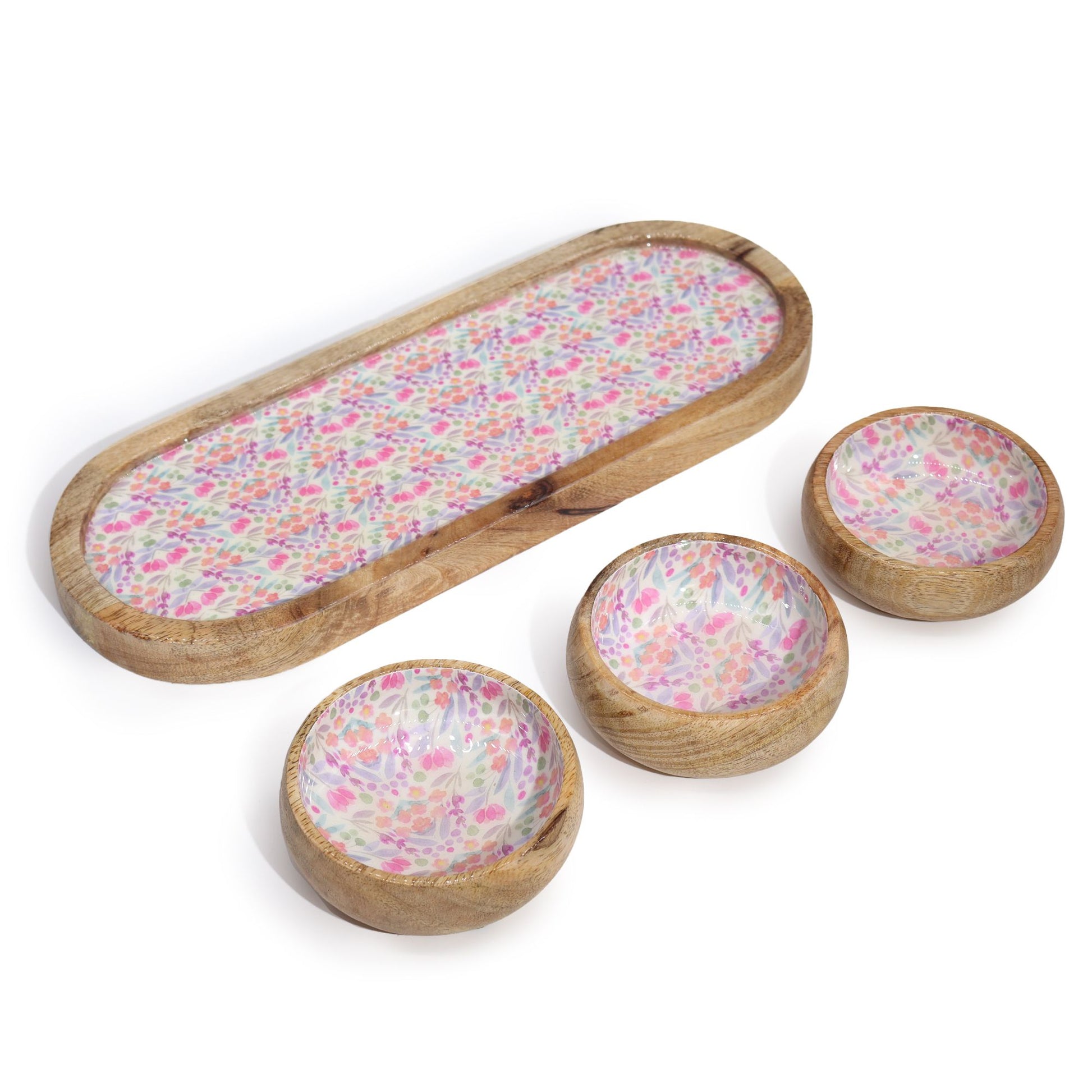 Set of wooden bowls with floral pattern on a white background