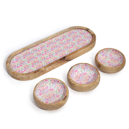 Set of wooden bowls with floral pattern on a white background