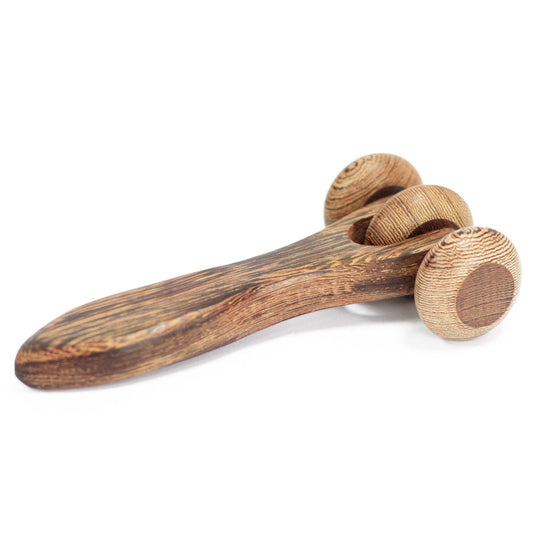 Wooden massage tool with two round rollers on a white background