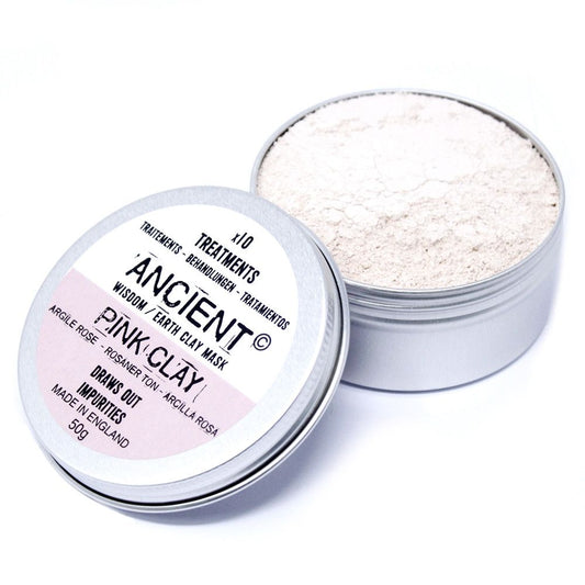 Open container of pink clay mask with visible powder inside on a white background