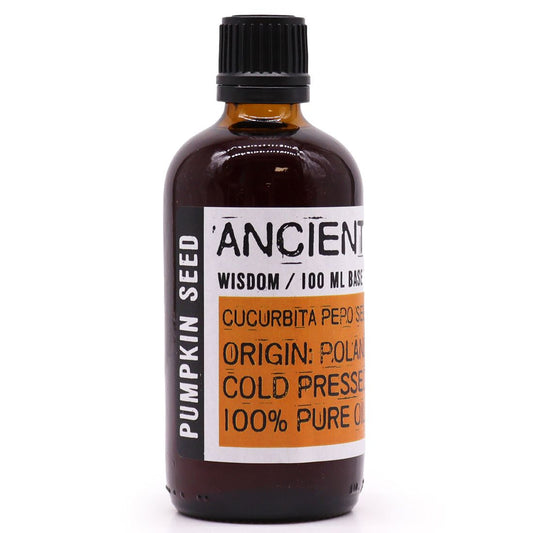 Bottle of pumpkin seed oil with a label on a white background