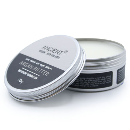 Open container of Ancient Argan Butter on a white background