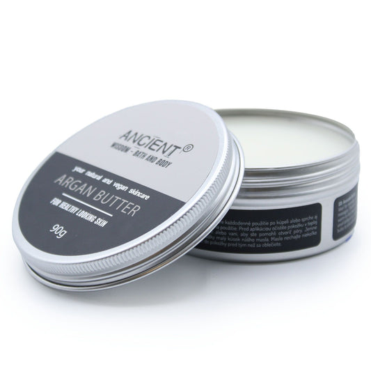Open container of Ancient Argan Butter on a white background