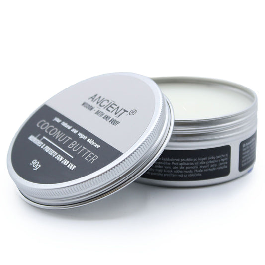 Open container of coconut butter with visible branding on a white background