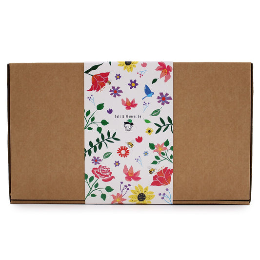 Floral-patterned box with a brown exterior on a white background