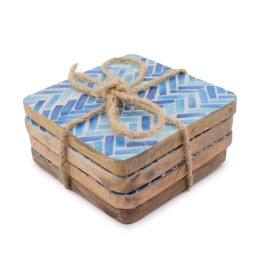 Set of square coasters with blue pattern and natural wood edges, tied together with twine on a white background.