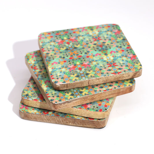 Set of four colorful square coasters on a white background