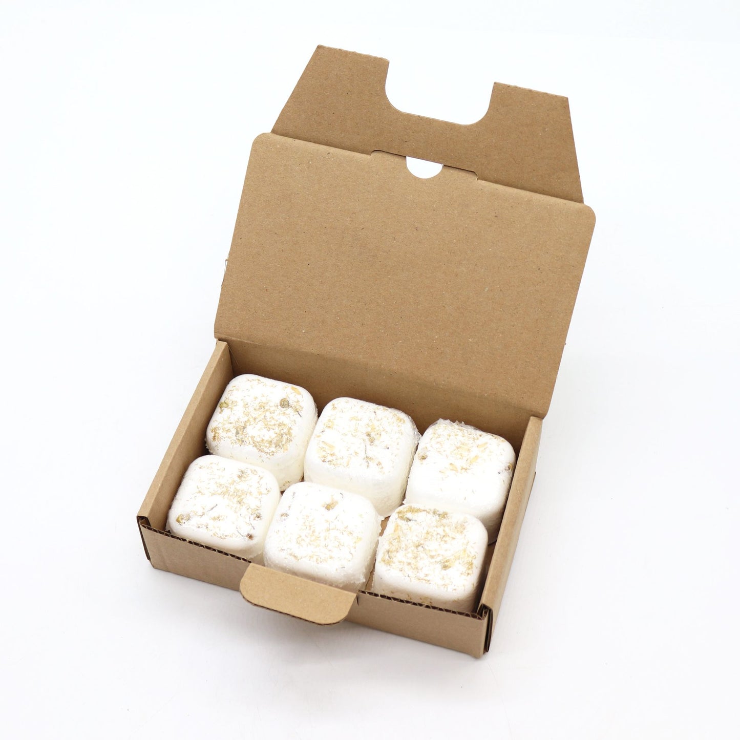 Box of white marshmallows with gold sprinkles on a white background