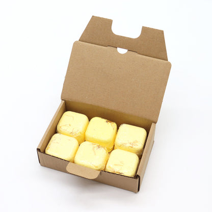 Cardboard box with yellow cubes on a white background
