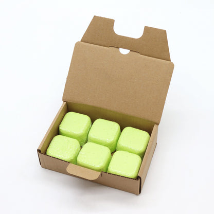 Open cardboard box containing six green cubes on a white background