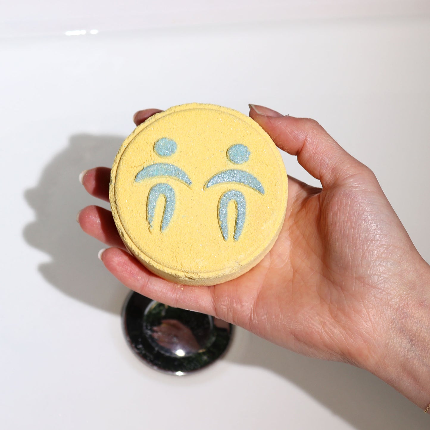 Treat yourself (or someone starry-eyed) to a cosmic soak with our Zodiac Bath Fizzers Gemini. The perfect pampering gift for astrology lovers! held in hand