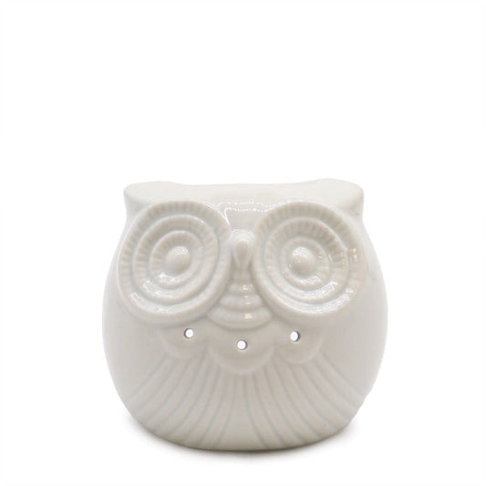 White ceramic owl-shaped object on a white background