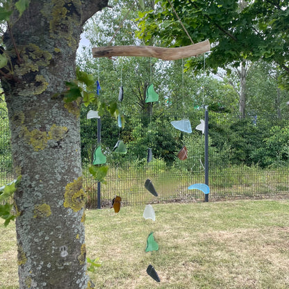 Bring harmony and a touch of nature to your outdoor space with a Recycled Glass Wind Chime Simple Hanging Five Strings. 