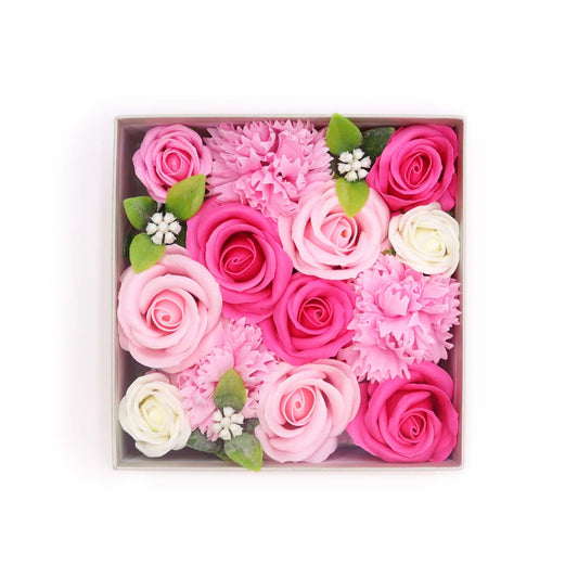 Box of pink and white flowers on a white background