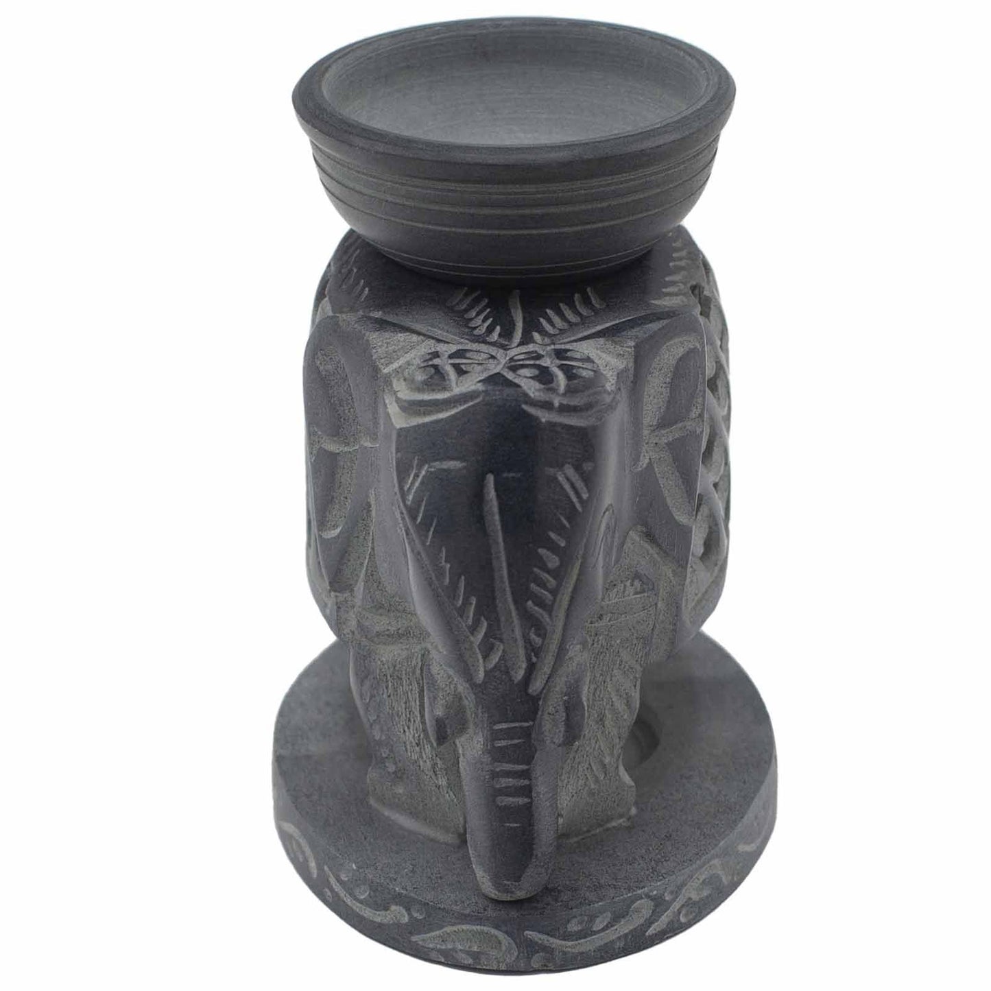 Decorative candle holder with elephant design on a white background