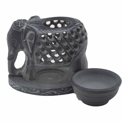 Decorative black ceramic oil burner with elephant design on a white background