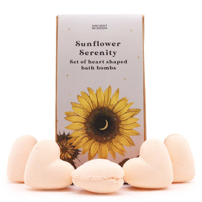 Heart-shaped bath bombs with a sunflower-themed packaging box on a white background
