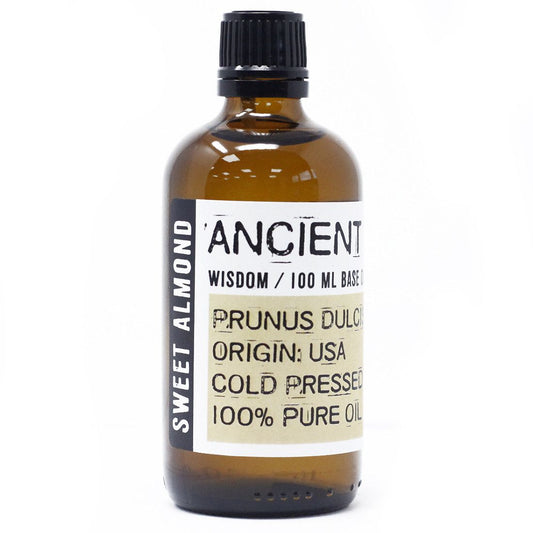 Bottle of sweet almond oil with a label on a white background