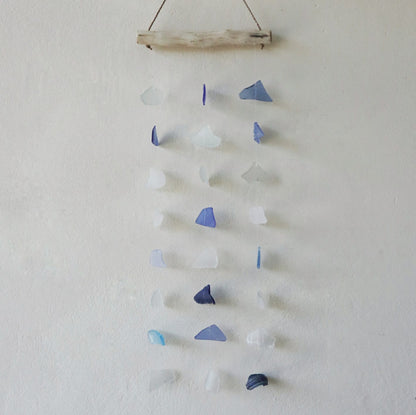 Bring harmony and a touch of nature to your outdoor space with a Recycled Glass Wind Chime Three Drop Blue &amp; White. 