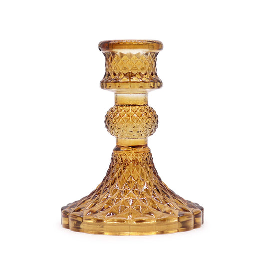Add a touch of timeless elegance to your dining table or living space with a Vintage Dinner Candle Holder in Antique Amber.