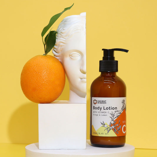 Body lotion bottle with an orange and decorative head on a yellow background