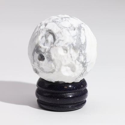 Embrace the calming and reflective energy of the Moon with this elegant White Howlite Planet. 