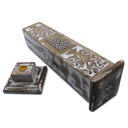 Decorative wooden incense holder with intricate carvings on a white background