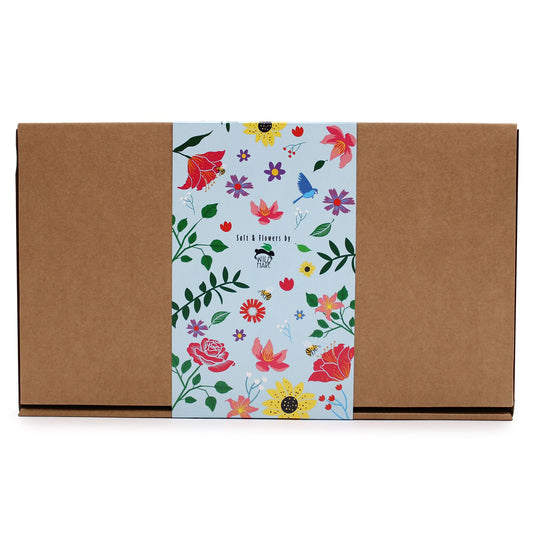Floral-patterned box with a brown exterior on a white background