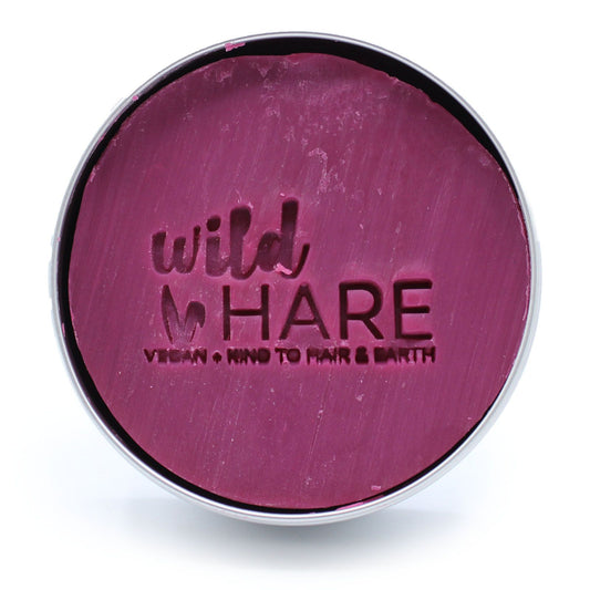 Round container with purple lid featuring 'wild HARE' branding on a white background