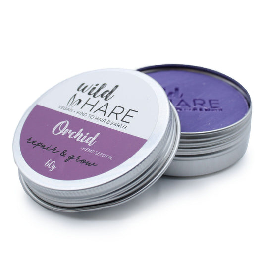 Stack of Wild Hare Orchid repair & grow tins on a white background