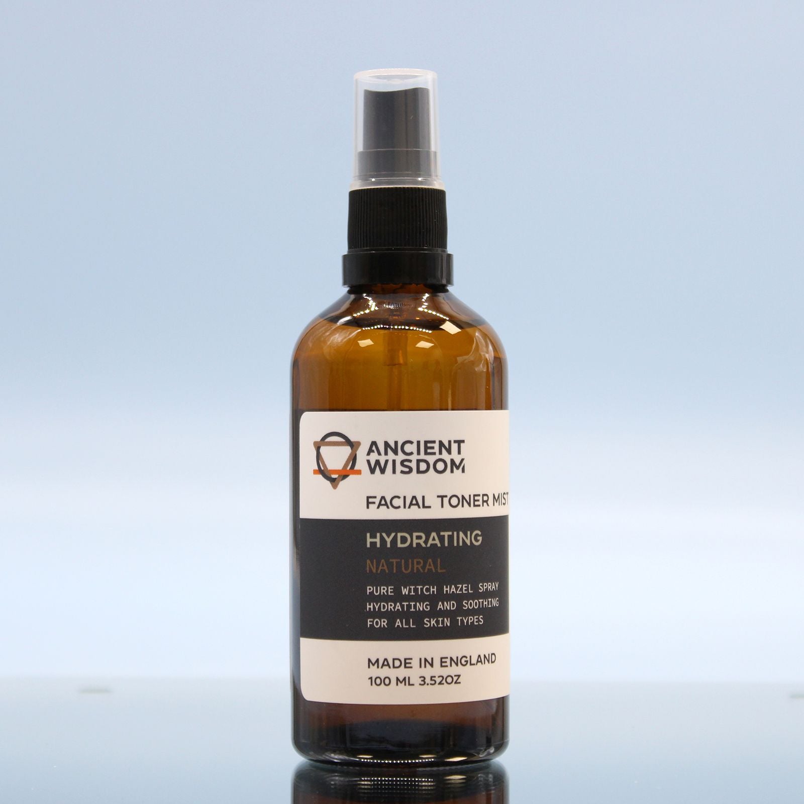 Facial toner mist bottle with 'Ancient Wisdom' label on a light blue background