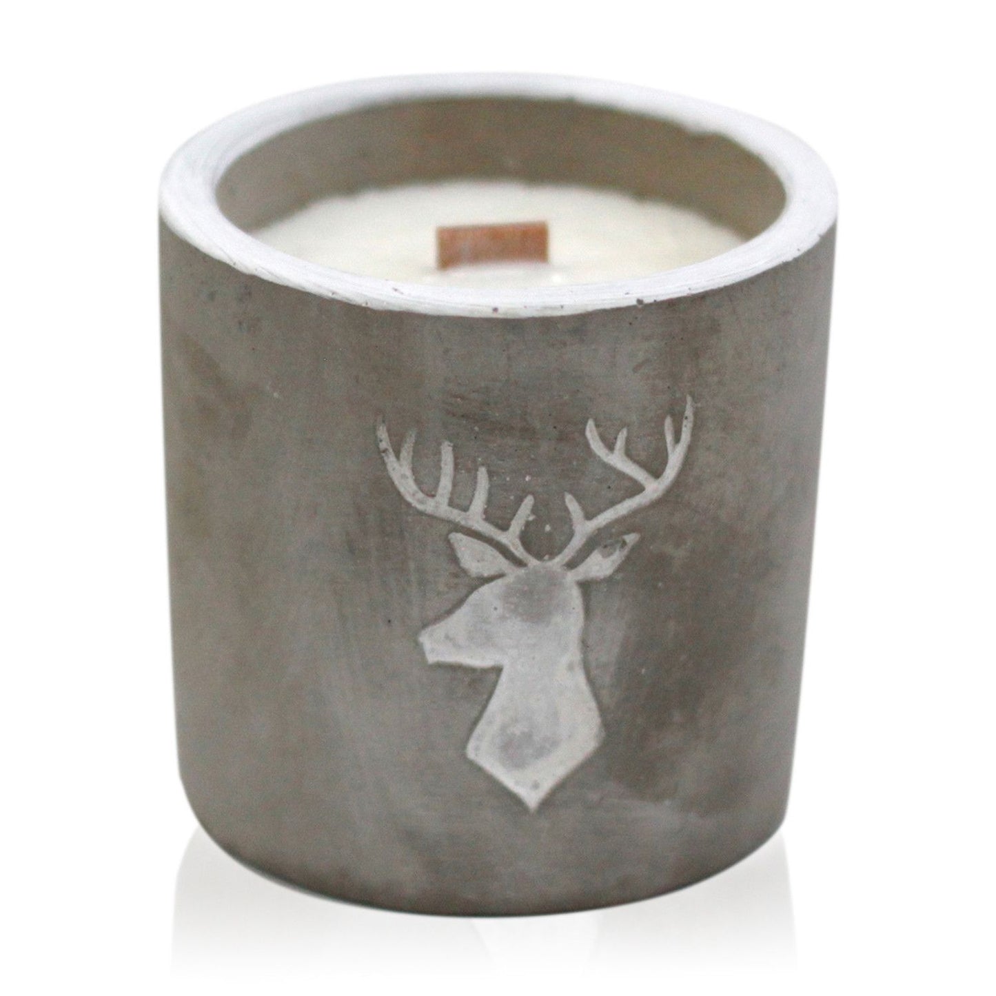 Candle in a concrete holder with a deer design on a white background