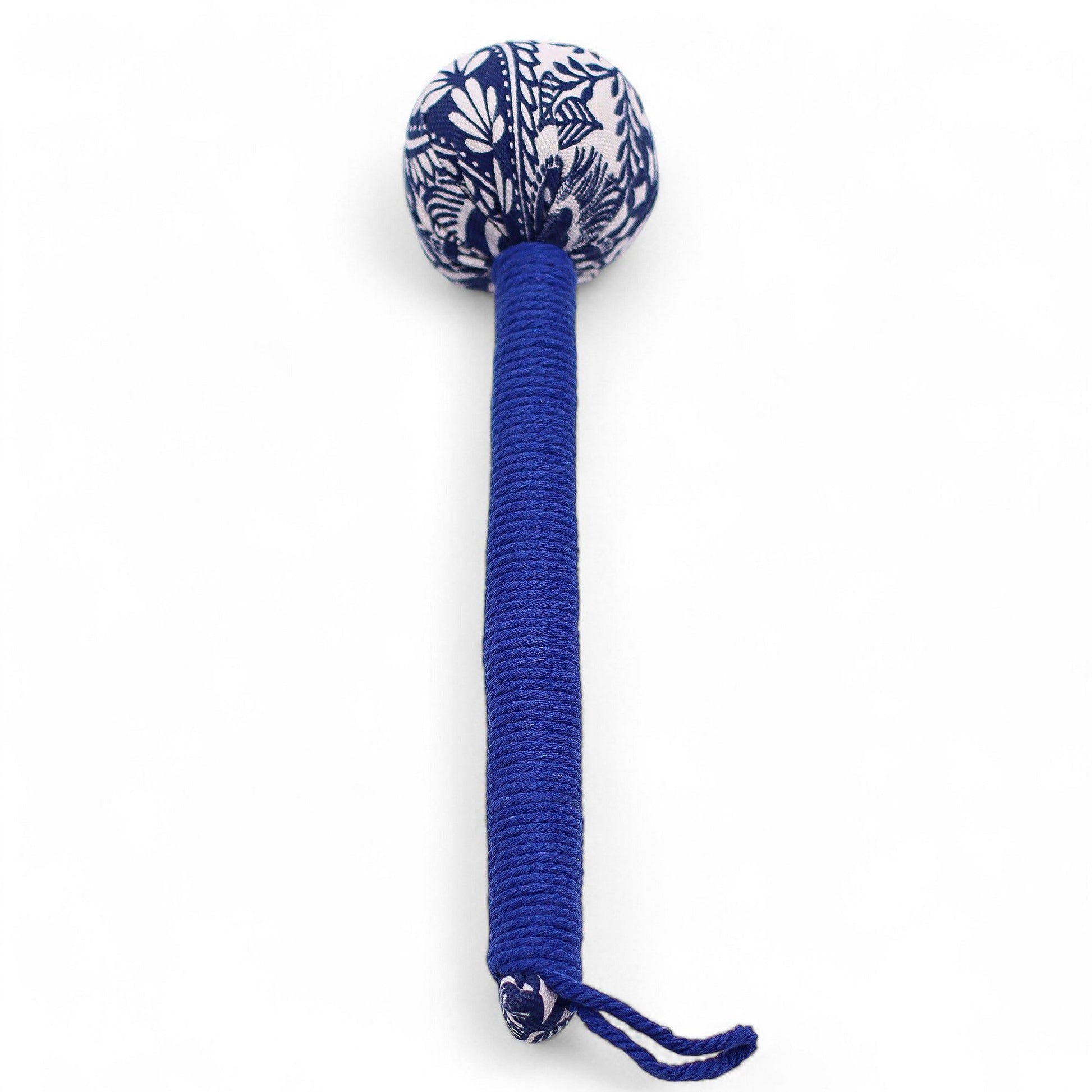 Blue and white patterned dog toy with a long handle on a white background
