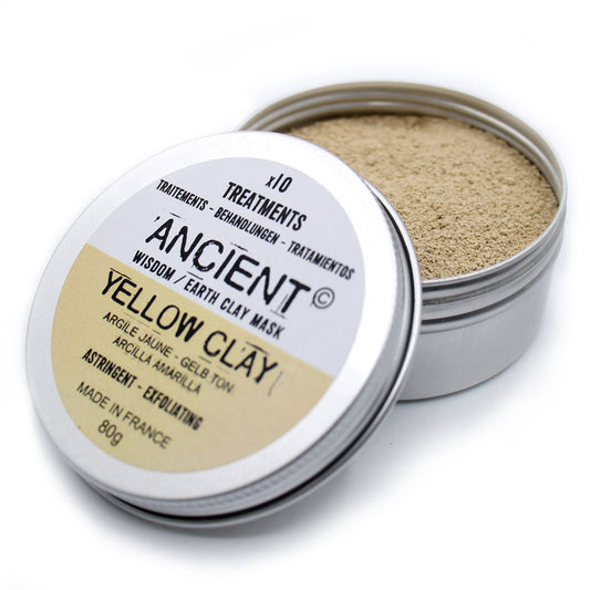 Open container of 'Ancient Yellow Clay' mask with visible clay powder inside on a white background.