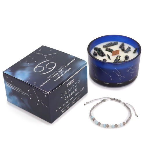 Zodiac Crystal Candle Cancer with Gemstone Bracelet is beautifully presented in a midnight blue glass jar adorned with silver-embossed star sign constellations. 