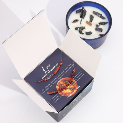 Zodiac Crystal Candle Leo with Gemstone Bracelet boxed is beautifully presented in a midnight blue glass jar adorned with silver-embossed star sign constellations. 