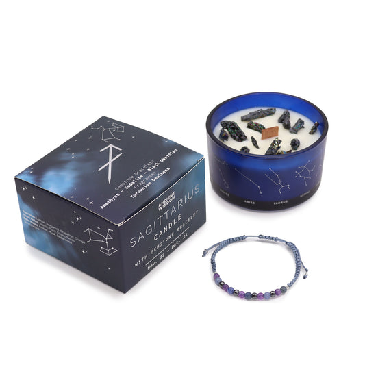 Zodiac Crystal Candle Sagittarius with Gemstone Bracelet is beautifully presented in a midnight blue glass jar adorned with silver-embossed star sign constellations. 