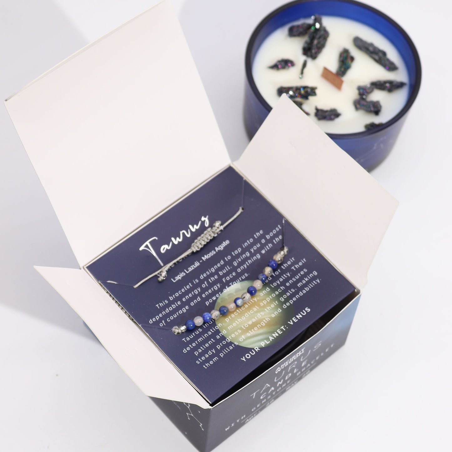Zodiac Crystal Candle Taurus with Gemstone Bracelet boxed  is beautifully presented in a midnight blue glass jar adorned with silver-embossed star sign constellations. 