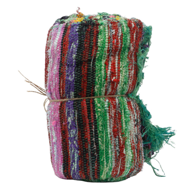 Multicolored striped fabric roll tied with string on a white background